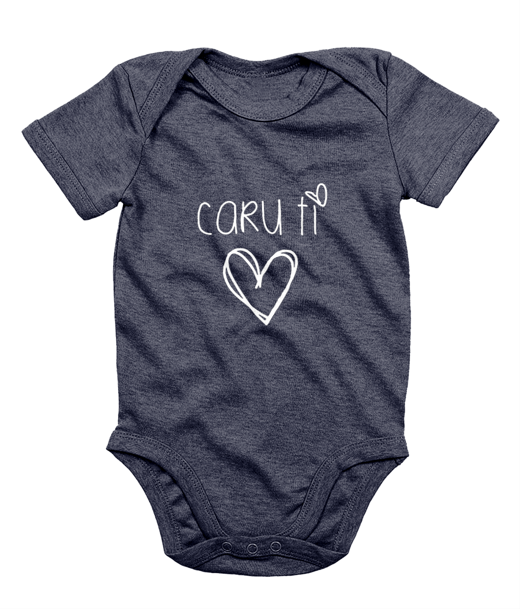 A navy blue babygrow with the phrase 'CARU TI' printed in white, resembling a simple heart design.