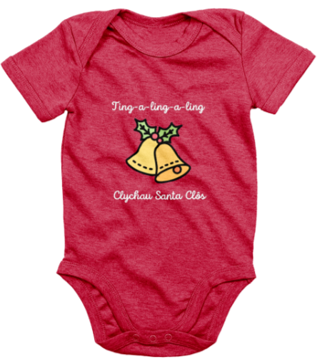 A red babygrow with the text 'Clychau Santa Clôs' printed on it, featuring a graphic of Santa's bells.