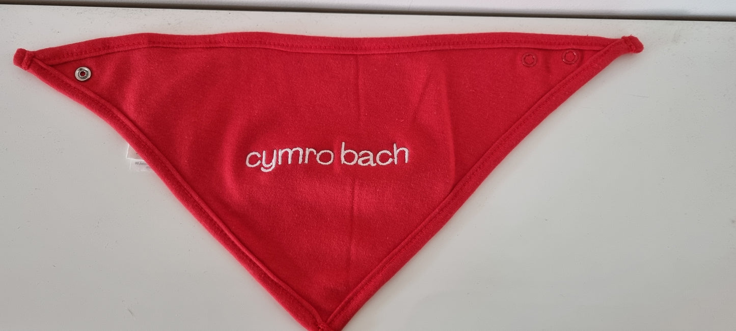 Red bandana cotton bib with 'cymro bach' text on a white background