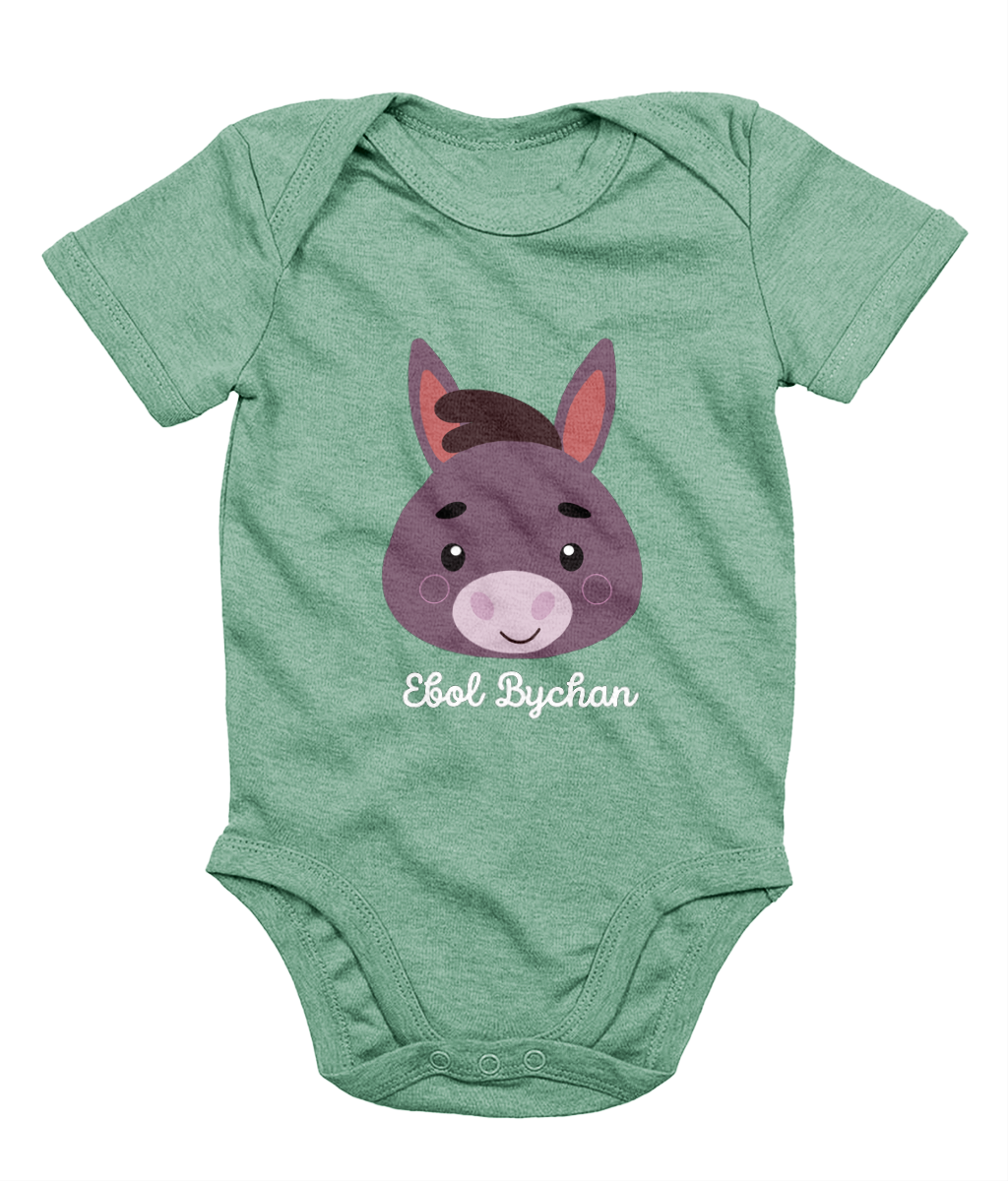 Green babygrow with a graphic of a donkey's face and the text 'Ebol Bychan' printed on the front.