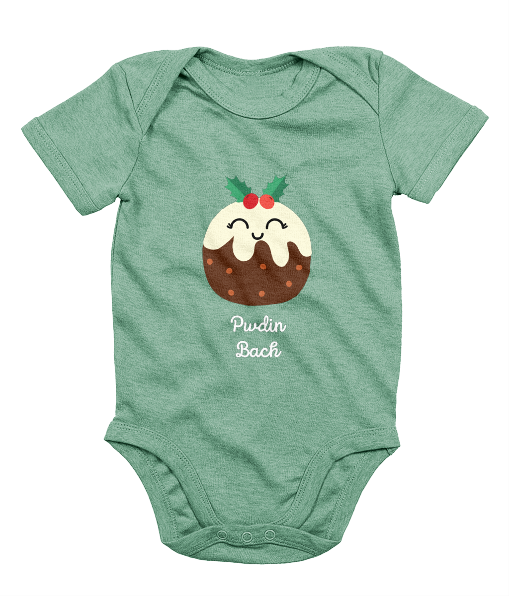 A green sleeveless babygrow with a graphic print of a Christmas pudding and the Welsh phrase 'Pwdin Bach'.
