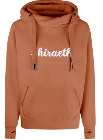 Burnt orange hoodie with 'hiraeth' text on a white background