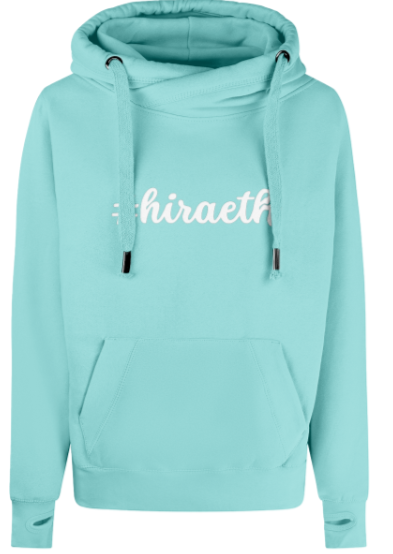 Light green hoodie with 'hiraeth' text on a white background