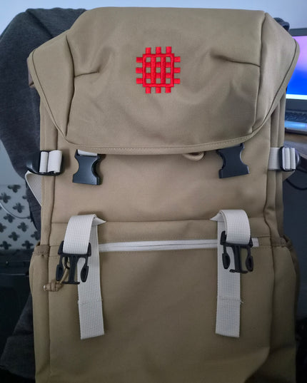 Beige bag with a red logo on a blue background