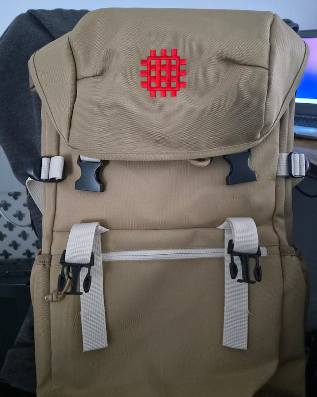 Beige bag with a red logo on a blue background