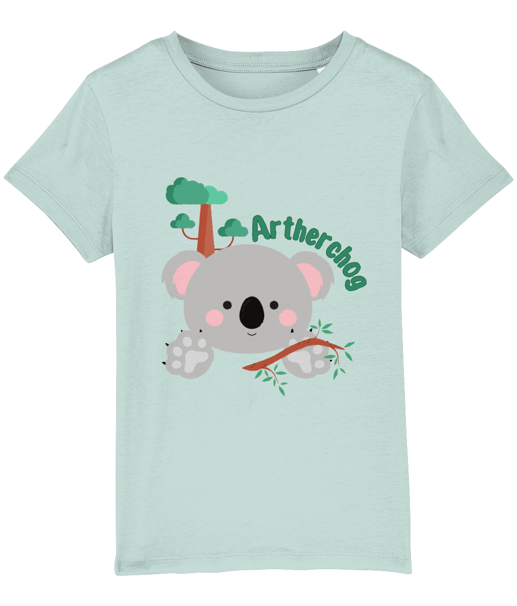 Children's t-shirt with a graphic of a koala bear and the text 'Artherchog'. The t-shirt is blue, and the graphic includes a small green tree.