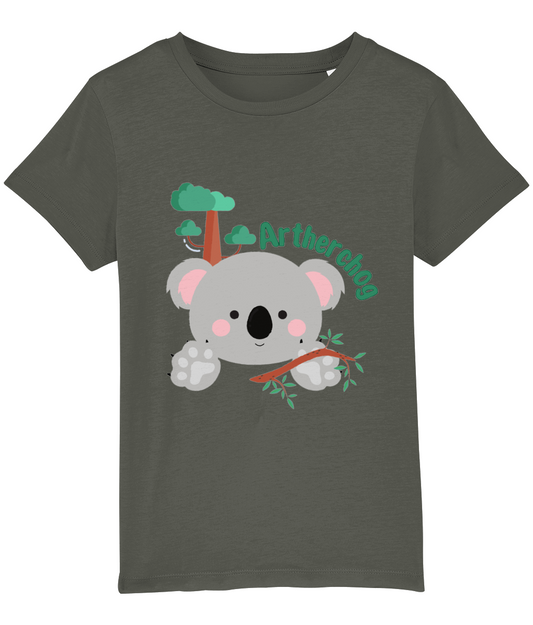 Children's t-shirt with a graphic of a koala bear and the text 'Artherchog'. The t-shirt is gray, and the graphic includes a small green tree.