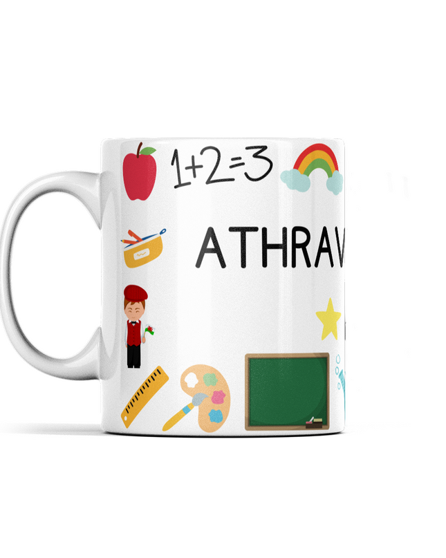 A white ceramic mug with a wraparound design featuring Welsh text, an apple, a paintbrush, and a chalkboard.