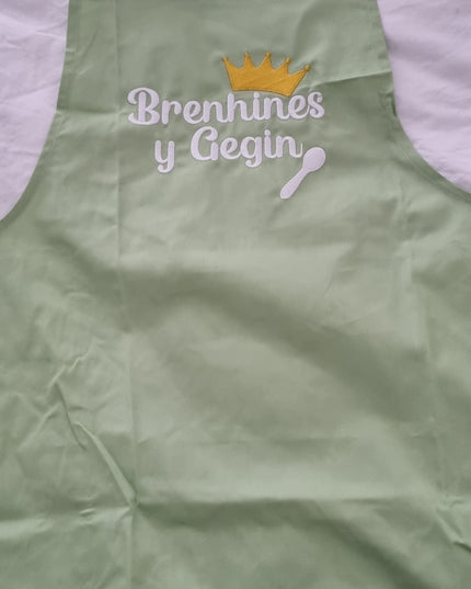 Brenhines y Gegin teal embroidered cotton apron