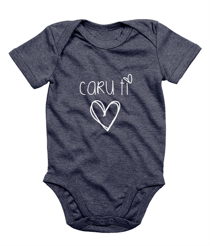 A navy blue babygrow with the phrase 'CARU TI' printed in white, resembling a simple heart design.