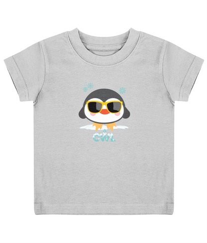A grey child's T-shirt with a graphic of a penguin wearing sunglasses and the text 'Cŵl'.