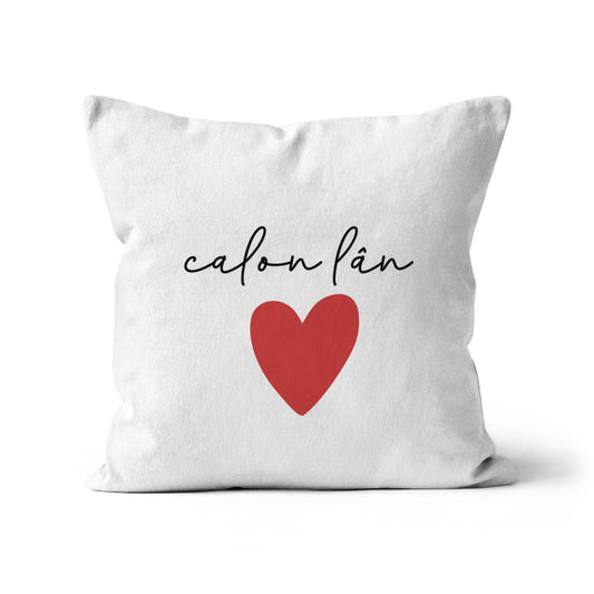 A square-shaped cushion with the text 'Calon Lán' in black script and a red heart symbol on a white background.