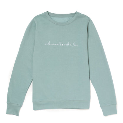 Light green sweatshirt with text on a white background