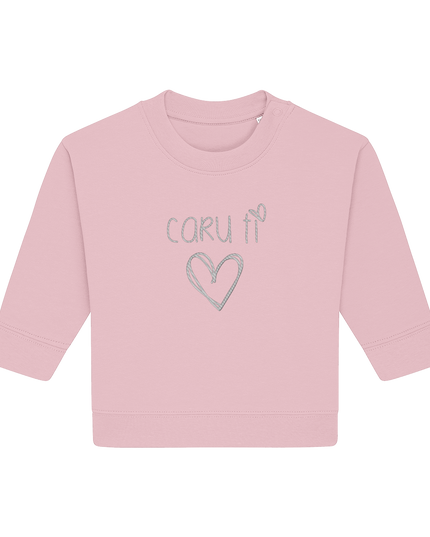 A pink toddler sweatshirt with the text 'caru ti' embroidered on the front, representing a Welsh expression of 'love you'. There is a heart symbol below the text.