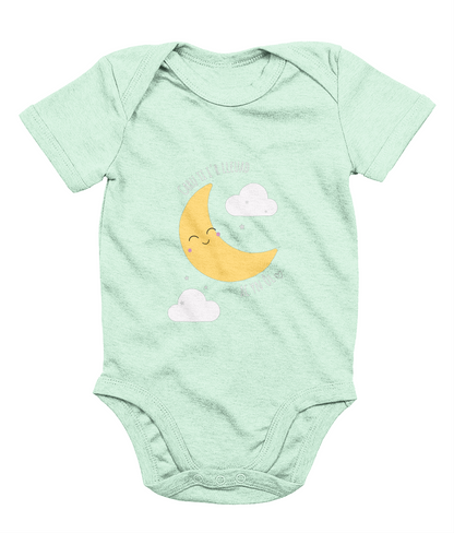 A mint babygrow with a graphic print of a crescent moon and clouds, and the phrase 'Caru Ti i’r Lleuad' printed on the front.