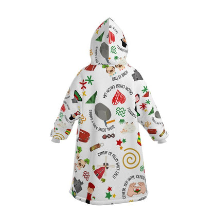 A white hoodie blanket with a welsh themed design.