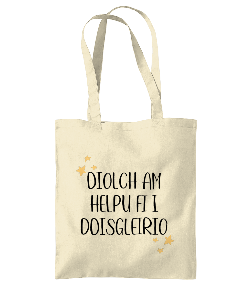 A beige cotton tote bag with the text 'Diolch am helpu fi' printed in black.