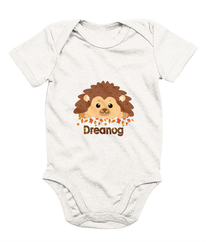 A white baby bodysuit with a cute hedgehog design and the Welsh word 'Draenog' printed on the front.