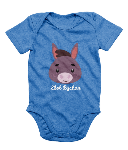 Blue babygrow with a graphic of a donkey's face and the text 'Ebol Bychan' printed on the front.