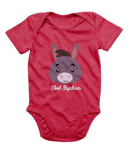 Red babygrow with a graphic of a donkey's face and the text 'Ebol Bychan' printed on the front.