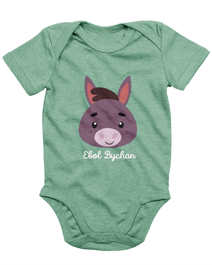 Green babygrow with a graphic of a donkey's face and the text 'Ebol Bychan' printed on the front.