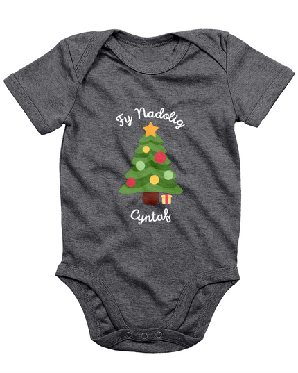 A navy babygro with 'Fy Nadolig Cyntaf' printed in Welsh, featuring a Christmas tree motif.