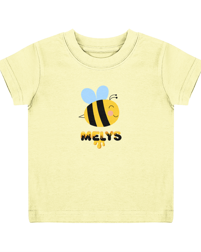 A pale yellow child's T-shirt with a graphic of a bee and the name 'Melys' printed below it.
