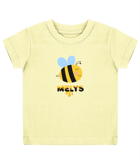 A pale yellow child's T-shirt with a graphic of a bee and the name 'Melys' printed below it.