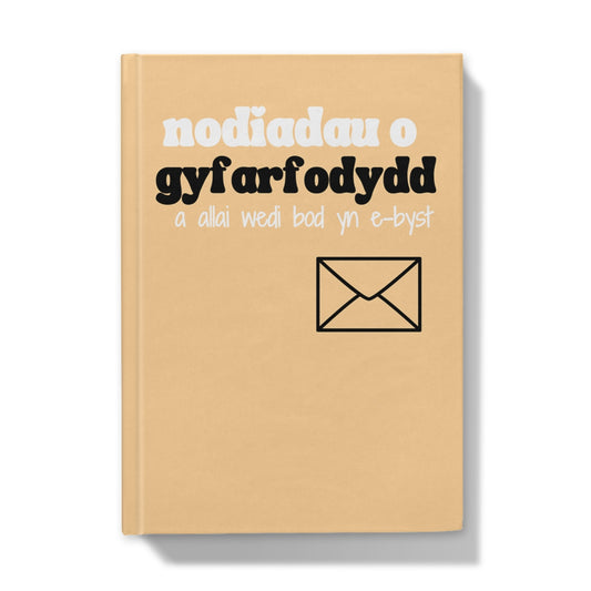 Hardback journal with a beige cover featuring text and a graphic that translates to 'meeting notes that should have been an email' in Welsh.