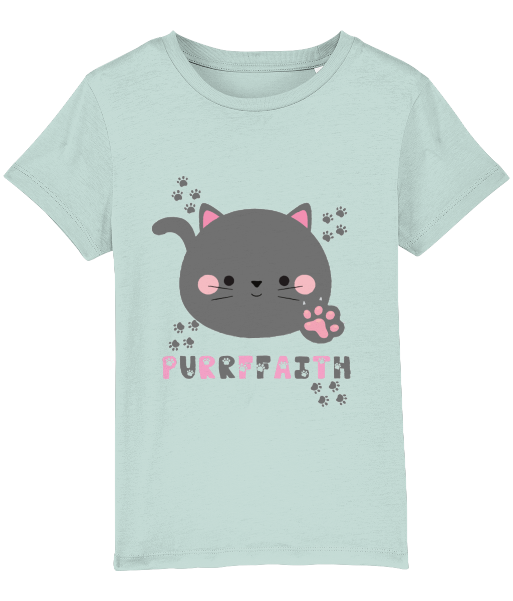 A light-colored girls' t-shirt with a graphic of a cartoon cat and the text 'Purrffaith'. The shirt is designed for children and is organic cotton.