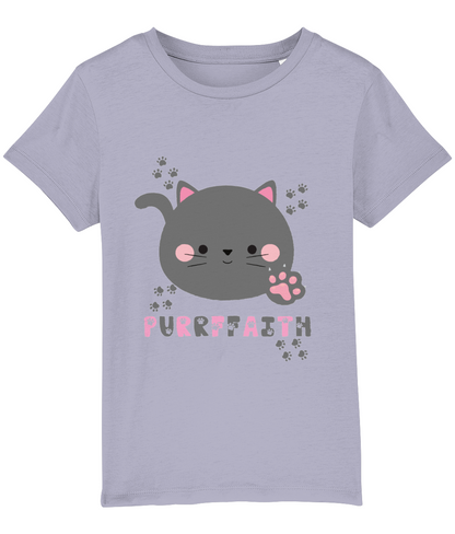 A light-colored girls' t-shirt with a graphic of a cartoon cat and the text 'Purrffaith'. The shirt is designed for children and is organic cotton.
