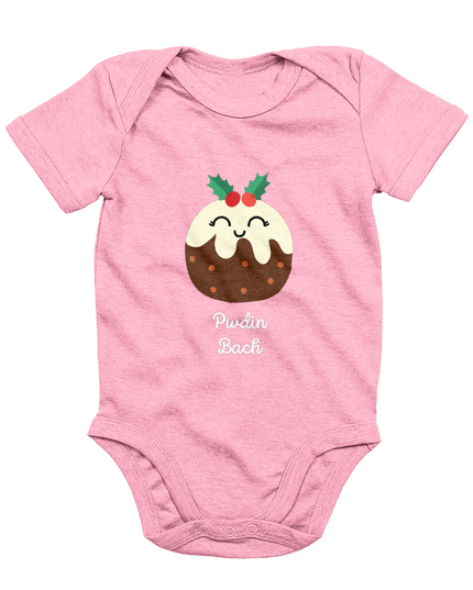 A pink sleeveless babygrow with a graphic print of a Christmas pudding and the Welsh phrase 'Pwdin Bach'.