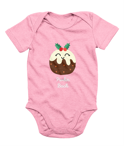 A pink sleeveless babygrow with a graphic print of a Christmas pudding and the Welsh phrase 'Pwdin Bach'.