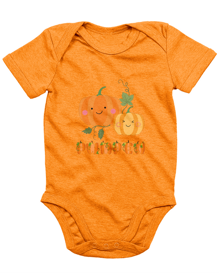 An orange babygrow with a 'Pwmpen' print featuring an illustrated pumpkin design.