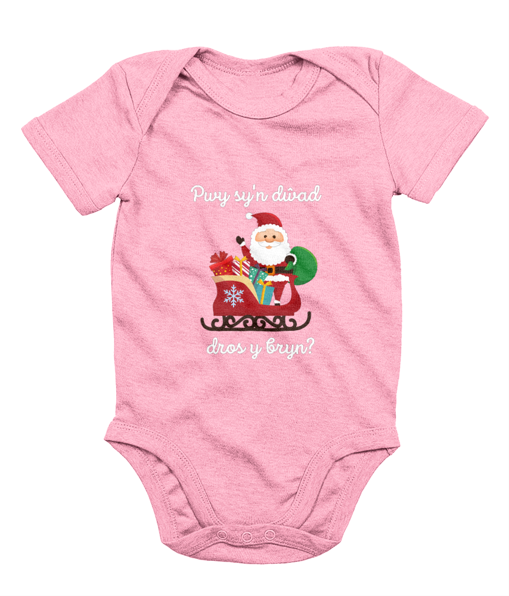 Pink sleeveless babygrow with a festive Welsh phrase and Christmas-themed graphics including Santa Claus.