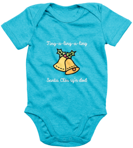 A blue babygrow with 'Santa Clos sy'n dod' printed in bold lettering, featuring an image of Santa Claus's sleigh bells.