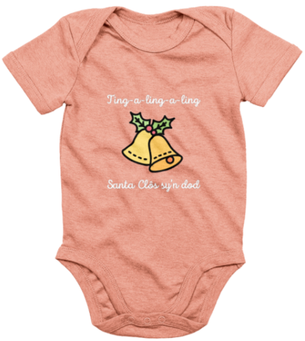 A pink babygrow with 'Santa Clos sy'n dod' printed in bold lettering, featuring an image of Santa Claus's sleigh bells.