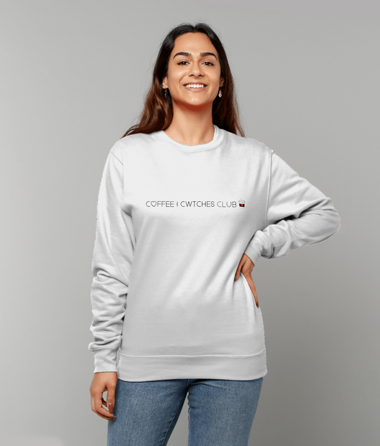 Woman wearing a white sweatshirt with text on a gray background