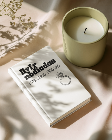 A white A5 wedding planning notebook with an engagement ring design on the cover