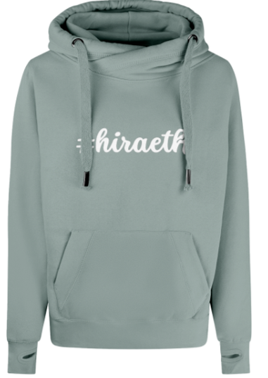 Green hoodie with '#hiraeth' text on a white background
