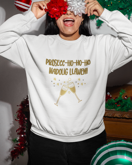 A person wearing a white Christmas sweatshirt with the text 'Prosecc-Ho-Ho-Ho' and a graphic of champagne glasses.
